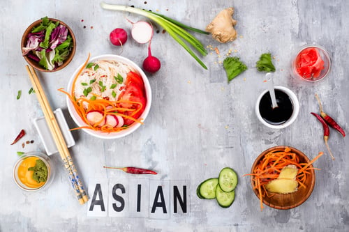 Preview: Asian rice noodles with vegetables and vegetarian salad on a plate on stone background