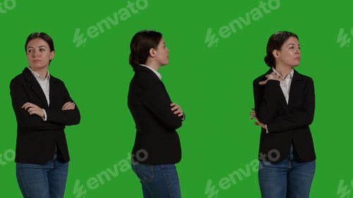 Preview: Close up of focused businesswoman standing over greenscreen backdrop