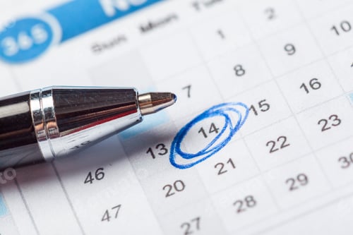 Preview: Marking an important date on a calendar with a blue pen