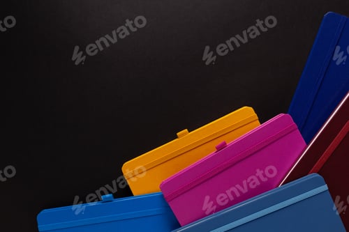 Preview: Paper notebook on black background texture. Creative idea concept