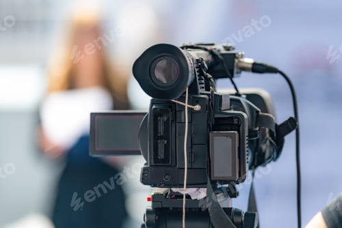 Preview: Camera recording at a media press conference preserves accurate details of the event.
