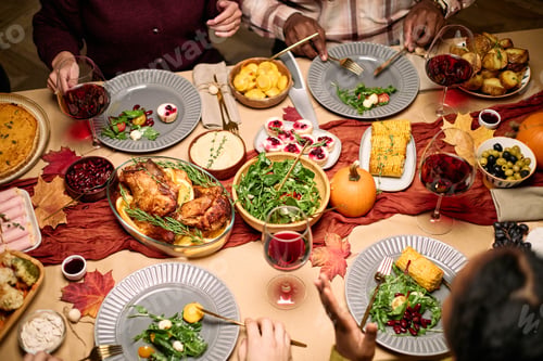 Preview: Multiethnic Young Adults Sharing Festive Meal and Conversing during Thanksgiving