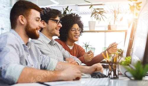 Preview: Programmers cooperating at IT company developing apps