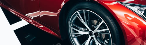 Preview: panoramic shot of new shiny red automobile with metallic wheel