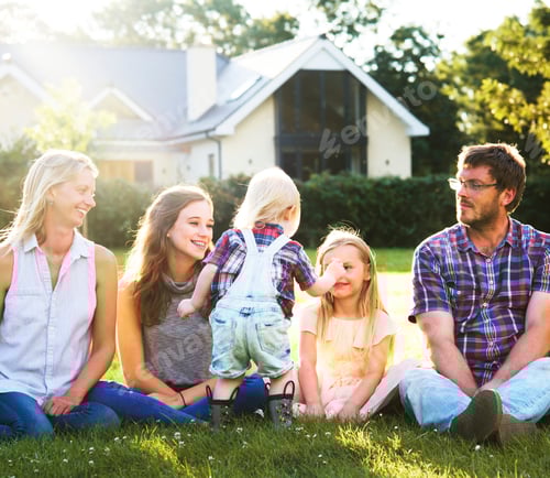 Preview: Family sitting in a park
