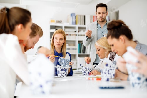 Preview: Group of business people working as team in office