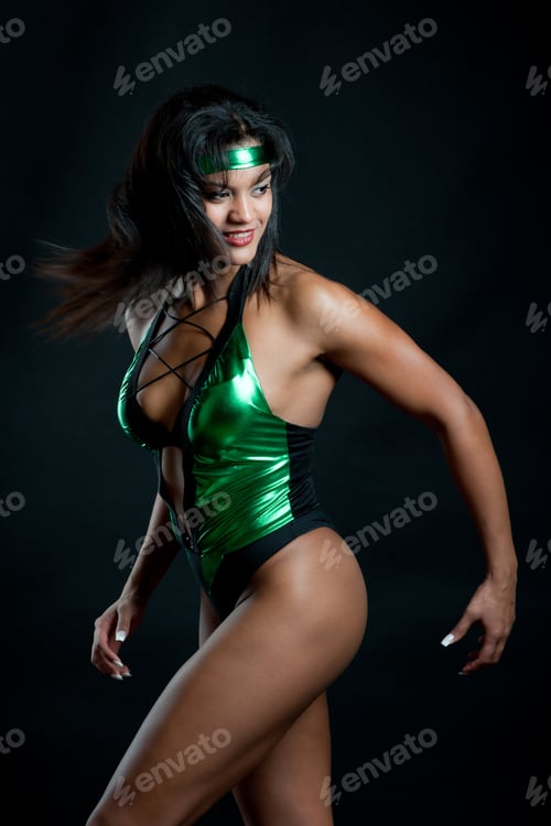 Preview: Muscular Strong Woman Posing Against Black Background