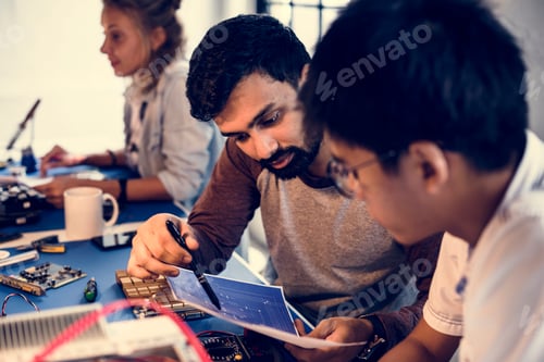 Preview: Technicians working on electronics parts