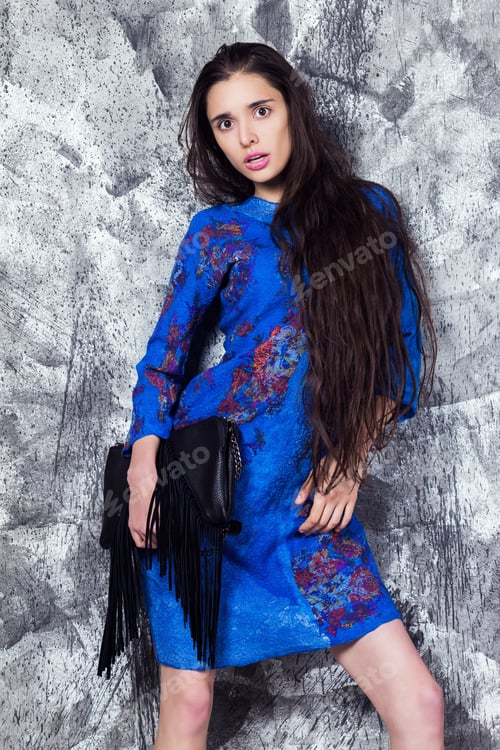 Preview: Beautiful Girl In A Warm Winter Dress And Handbag