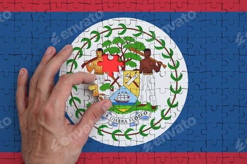 Preview: Belize flag is depicted on a puzzle, which the man's hand completes to fold.
