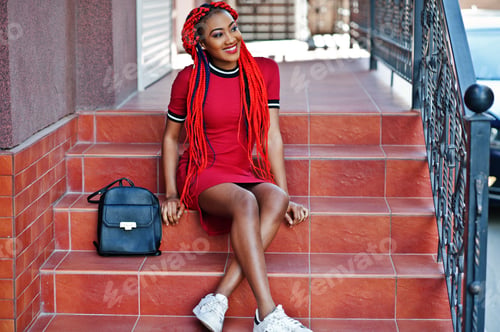 Preview: African american girl in red dress with dreadlocks