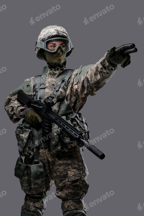 Preview: Soldier woman pointing away dressed in modern protective uniform
