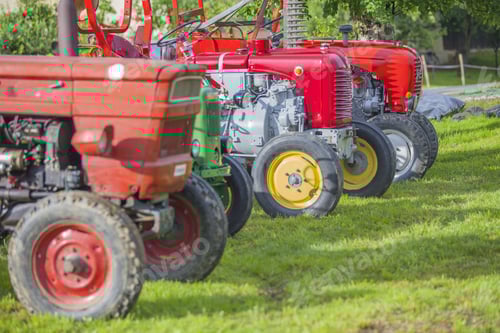 Preview: Row of tractors on a field