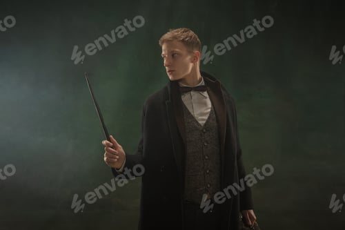 Preview: Young man in art action isolated on dark green background. Retro style, comparison of eras concept