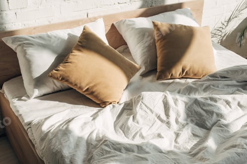 Preview: bed with pillows with sunlight and shadows