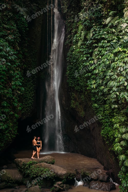 Preview: Couple at a tropical waterfall. The couple travels to the island of Bali in Indonesia