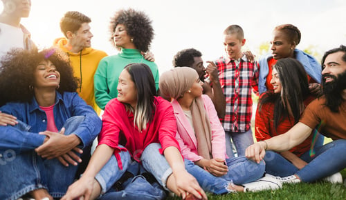 Preview: Young diverse people having fun outdoor chatting together