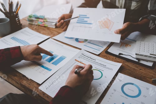Preview: Business people meeting explaining the financial graph data and marketing plan. Group of business pe