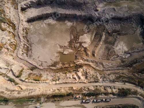 Preview: Aerial view of Slope operating granite quarry with mining equipment on ledges