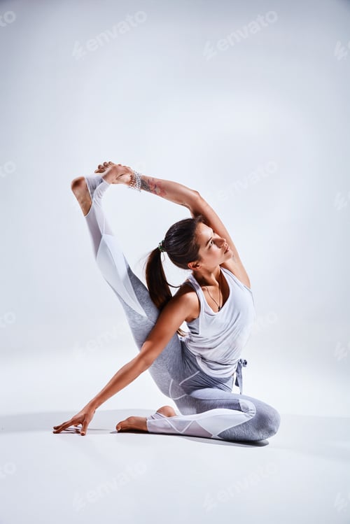 Preview: Woman doing yoga isolated on white background