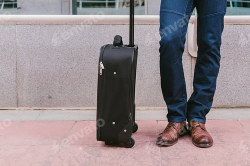 Preview: Man carries luggage in the lobby before the trip. Travel and vacation concept. lifestyle.