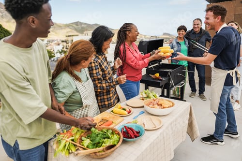 Preview: Multi generational people doing barbecue at home's rooftop