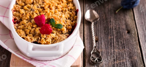 Preview: Plum and raspberry crumb on the old wooden background. Rustic style. Selective focus.
