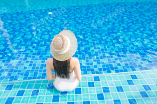 Preview: Portrait beautiful young asian woman relax smile around outdoor swimming pool