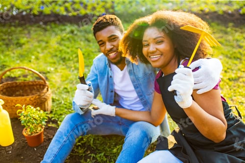 Preview: brazilian family harvesting or planting a crop in spring sunny day outdoors