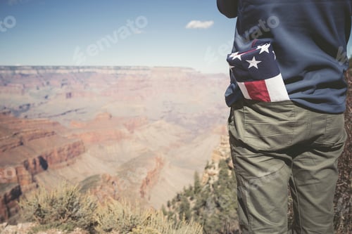 Preview: USA, Grand Canyon, man with American Flag in his pocket, partial view
