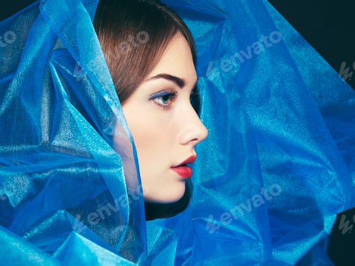 Preview: Fashion photo of beautiful women under blue veil