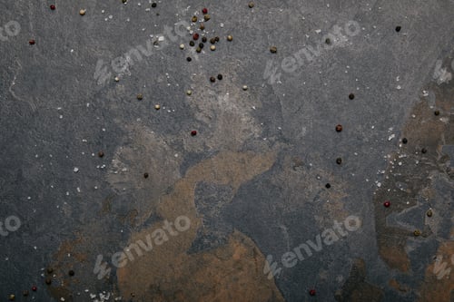 Preview: top view of scattered salt and allspice on grey marble background
