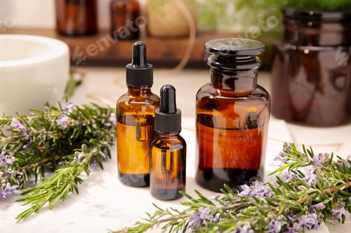 Preview: Rosemary essential oil on vintage apothecary bottles