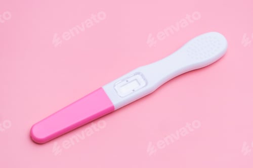 Preview: Pregnancy test isolated on the pink background