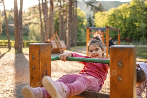 Preview: Active cute little girl on the playground