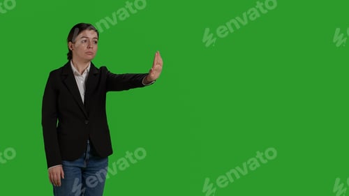 Preview: Side view of businesswoman showing no sign with palm