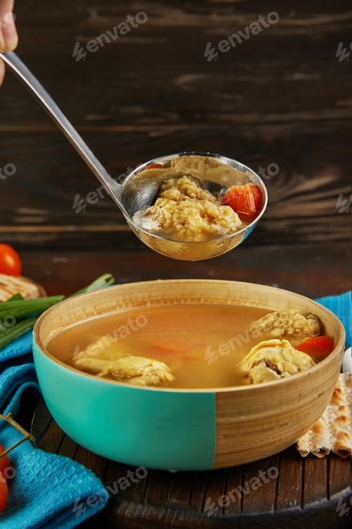 Preview: Soup with matzo dumplings and chicken with carrots and tomatoes is poured