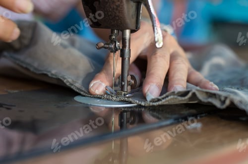 Preview: Closeup Sewing Process with old man designer hand