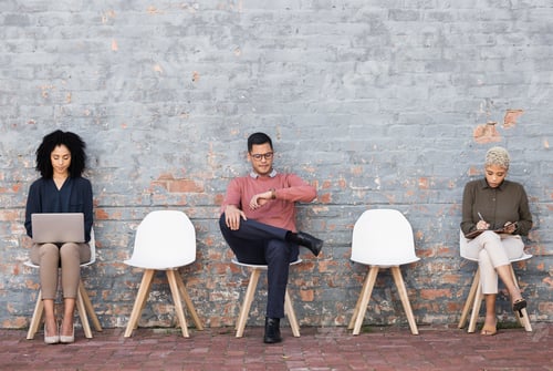 Preview: Business people, waiting room and sitting on chairs against brick wall for interview, meeting or op