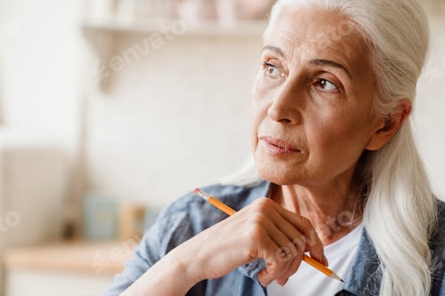 Preview: Close up portrait a pensive senior woman thinking