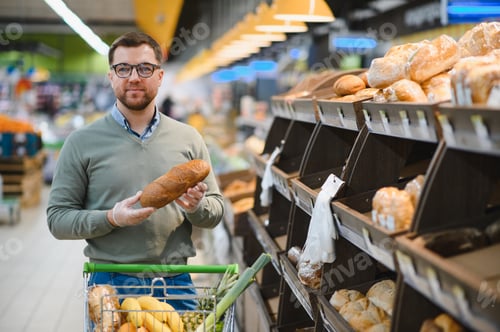 Preview: Portrait of handsome man customer in supermarket
