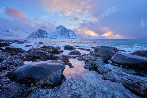 Preview: Coast of Norwegian sea on rocky coast in fjord on sunset
