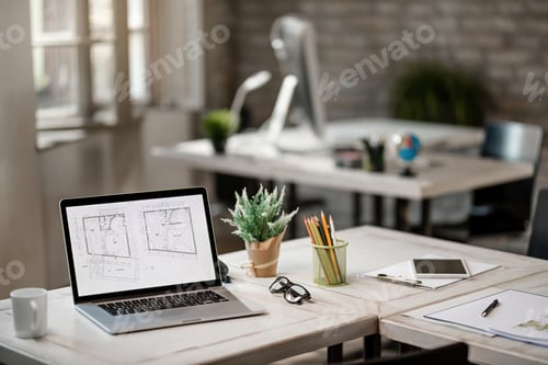 Preview: Architectural plans on screen of laptop in the office.