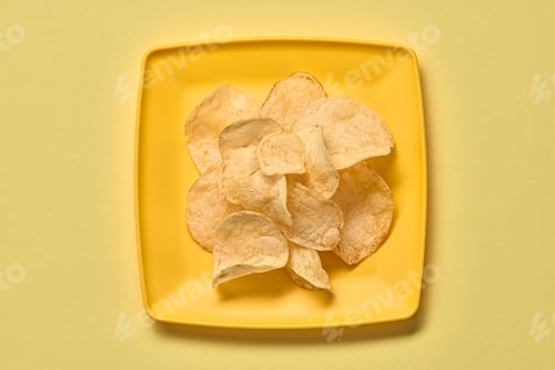 Crisp Potato Chips on a Yellow Plate