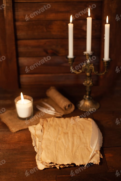 Preview: Halloween still life with burning candle on witch book and magic objects