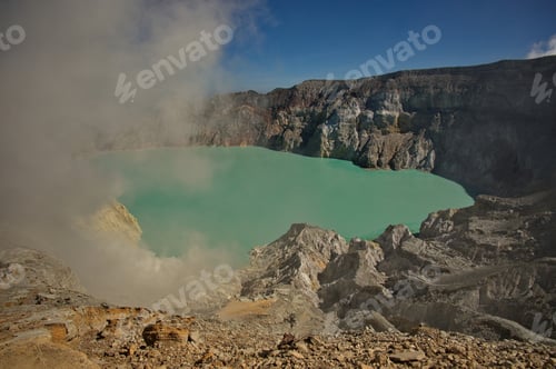 Preview: Scenic view of Ijen volcano, Indonesia with clouds above the crater