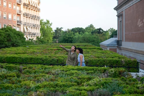 Preview: Interracial couple admiring view from rooftop garden in madrid