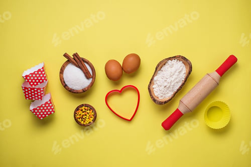 Preview: Ingredients for baking on yellow background