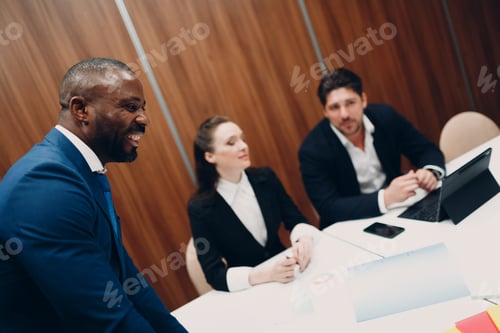 Preview: Black boss Businessman and team at office meeting. Business people group conference discussion