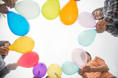 Preview: diversity group of people held colorful balloons to show unity and solidarity in LGBTQ community
